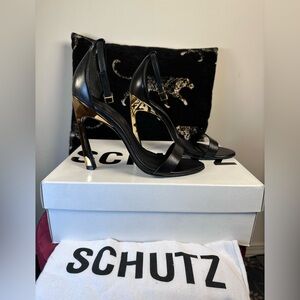 Schutz Cadey-Lee Curve Sandal in Black high heel stiletto gold ankle strap